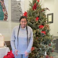 woman with chriatmas tree